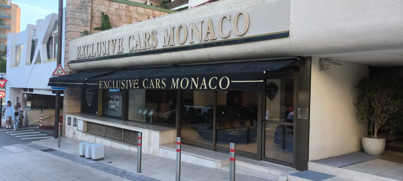 Entrance of the Exclusive Cars Monaco showroom seen from the street